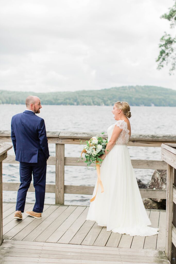 Bride and groom first look on the lake