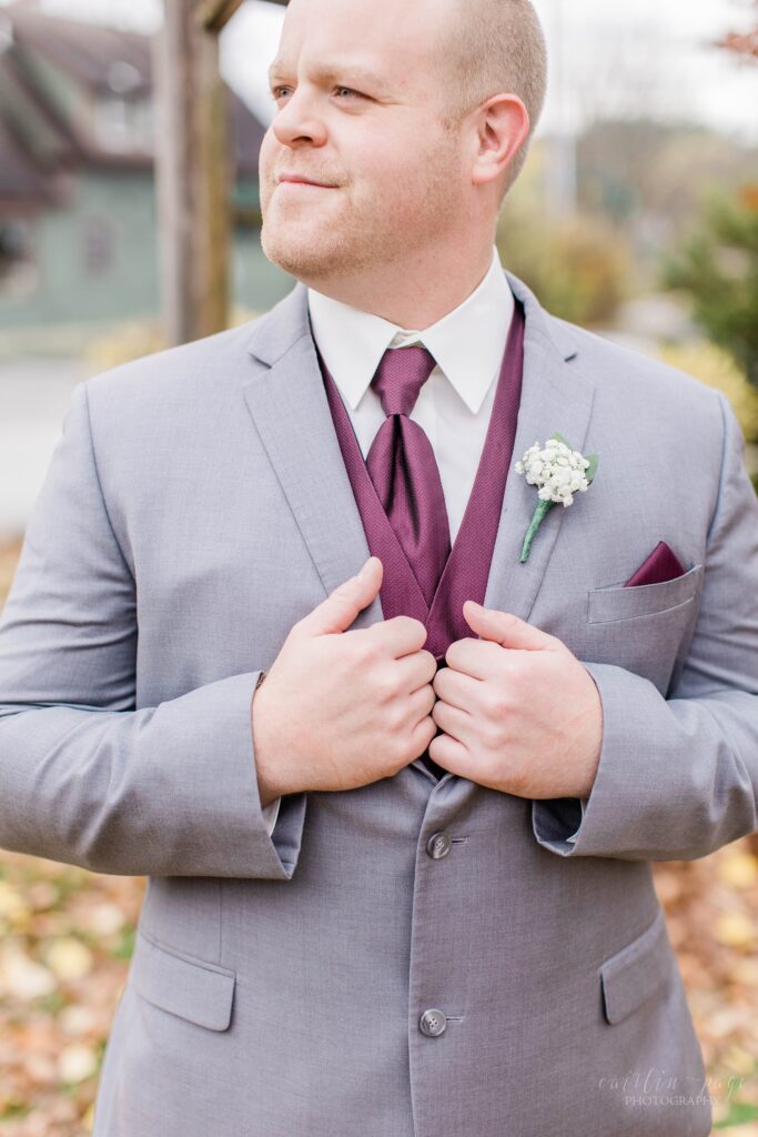 Groom holding onto his lapels