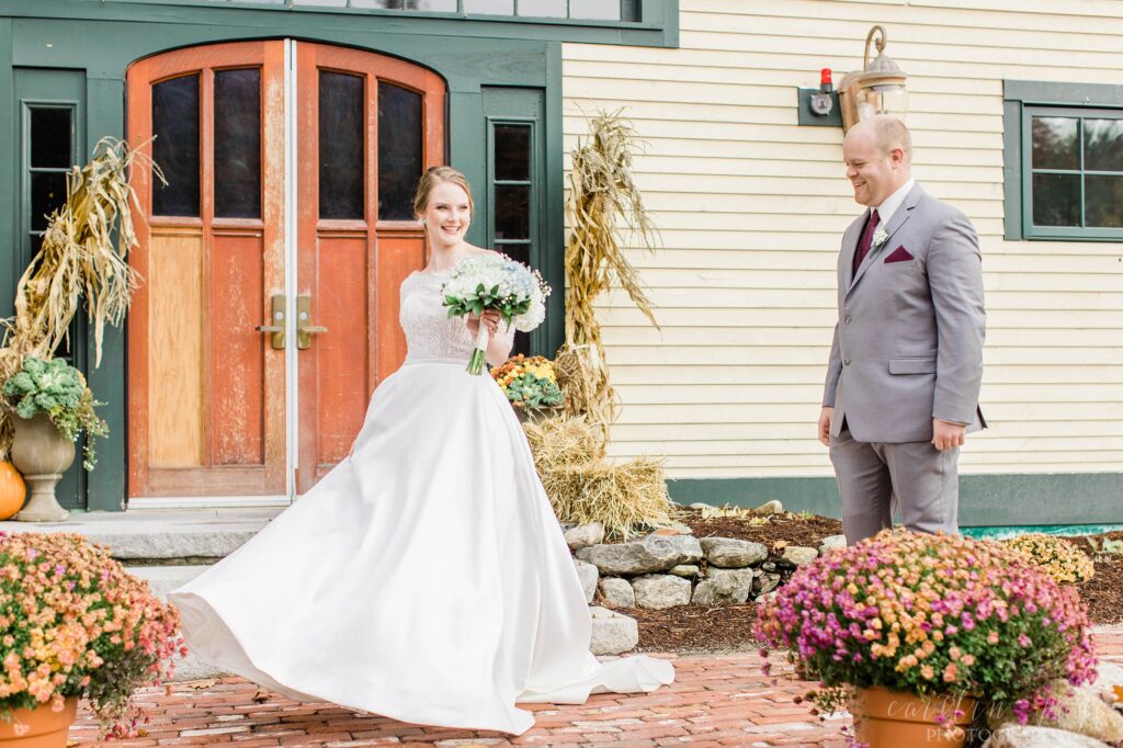 Bride and groom first look in front of barn