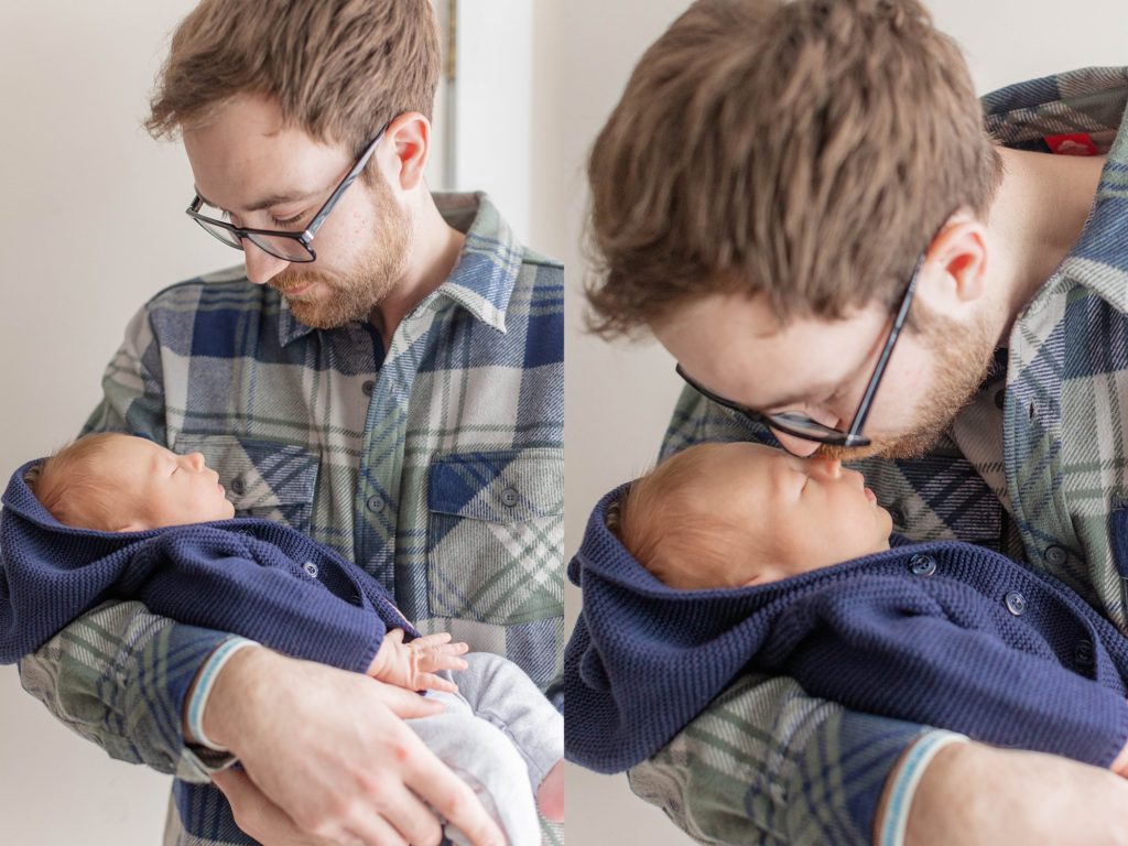 Dad holding newborn baby boy