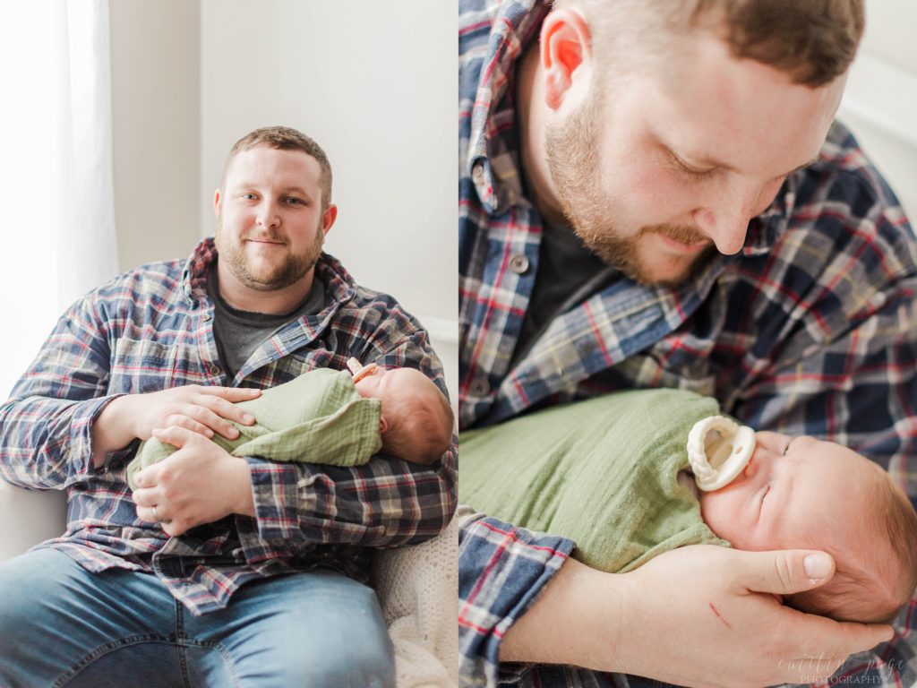 Dad holding newborn baby boy