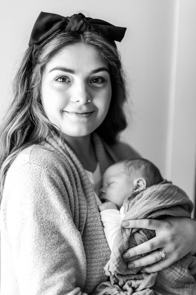 Mom holding newborn baby boy