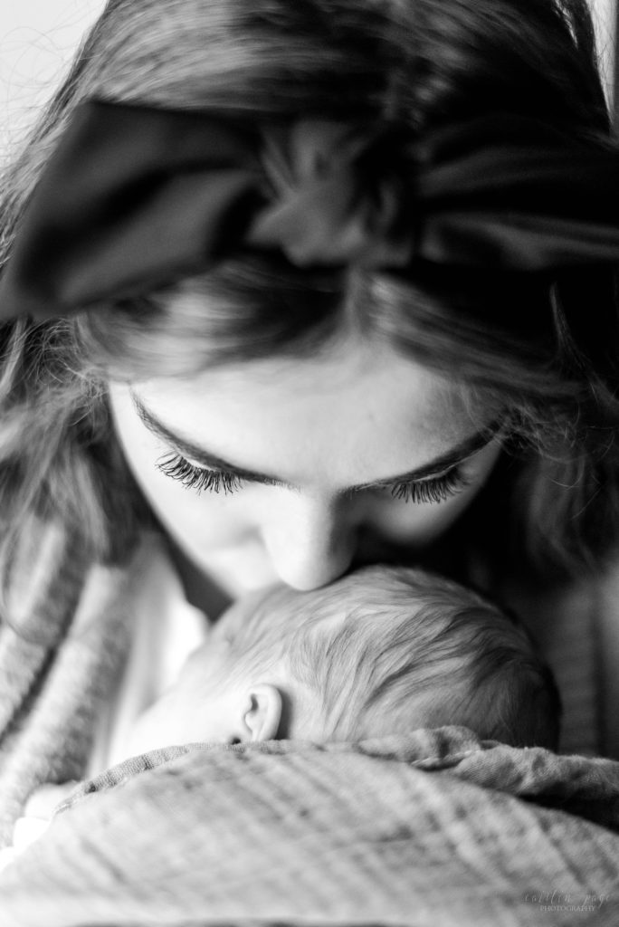 Mom holding newborn baby boy