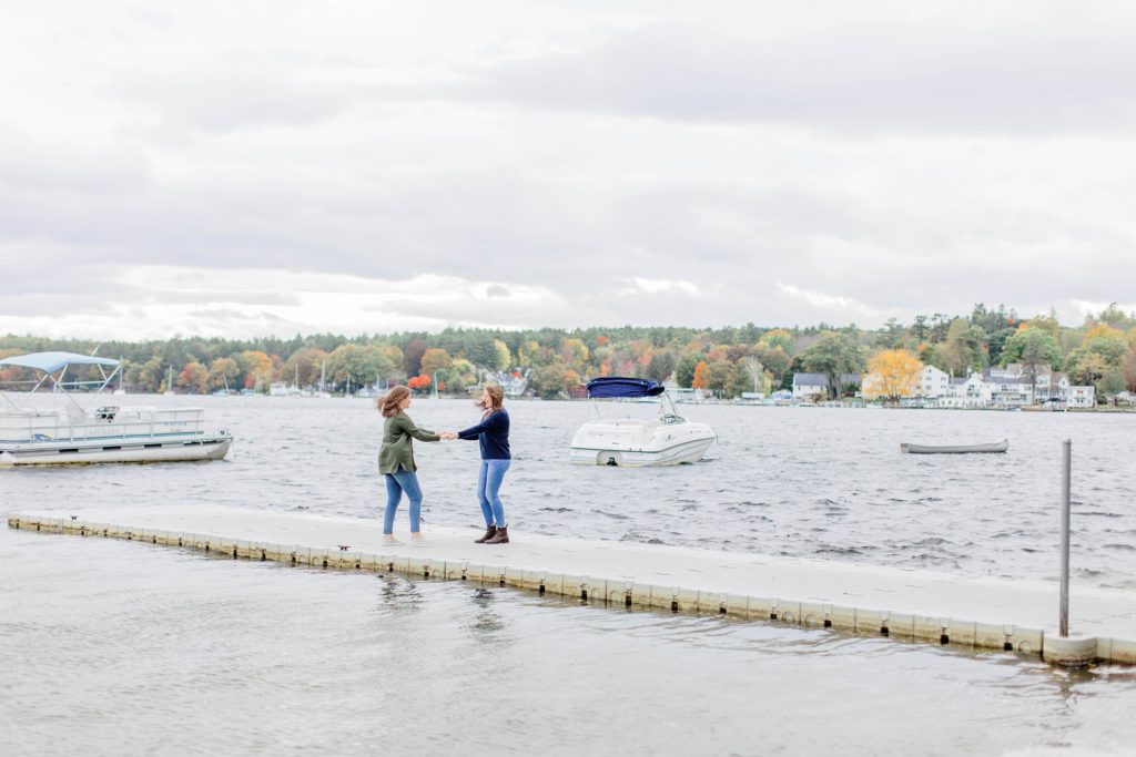 Lakeside fall engagement session at Lake Winnipesaukee with a puppy
