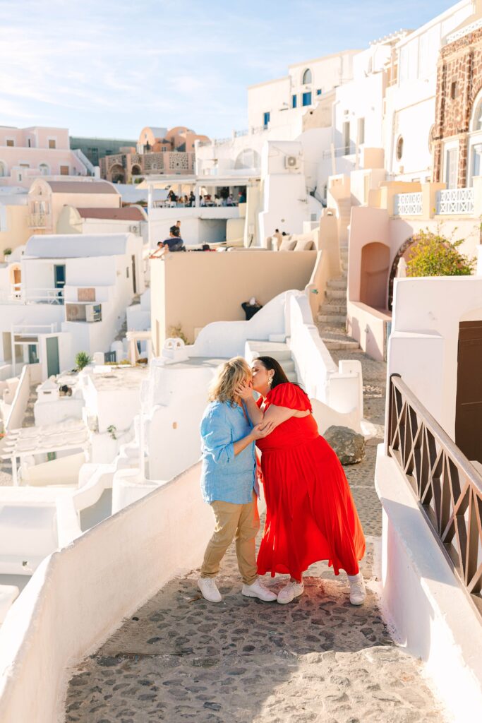 Colorful couple in Oia Santorini Greece Caitlin Page Photography
