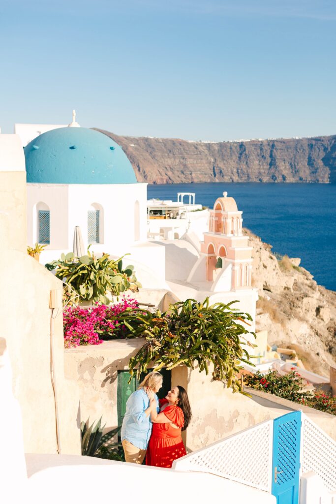 Colorful couple in Oia Santorini Greece Caitlin Page Photography