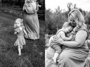 Black and white image of a little girl looking back while walking across a grassy lawn with her mom. Black and white photo of mother holding her baby daughter close while sitting outdoors.