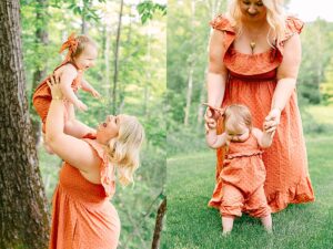 Mother lifting baby girl joyfully into the air beside a tree, both smiling brightly. Mom helping her baby girl walk barefoot in the grass, gently holding her hands for balance.